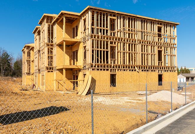 a close-up of temporary chain link fences enclosing a construction site, signaling progress in the project's development in Lapwai, ID